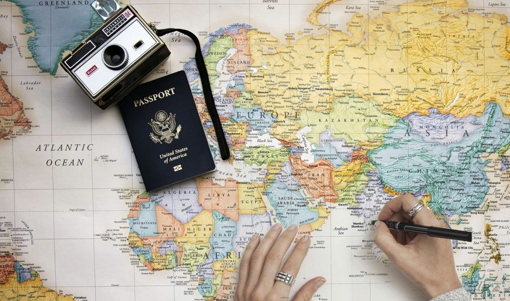 Camera, passport and a map