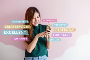 Smiling woman giving her customer review using her phone