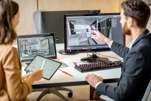 Interior designer creating designs in a computer while in the office
