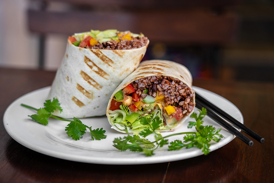 Raw food wrap with vegan ingredients on a plate