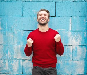 Man happy, satisfied smiling expression.