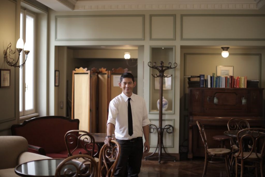 Restaurant owner smiling