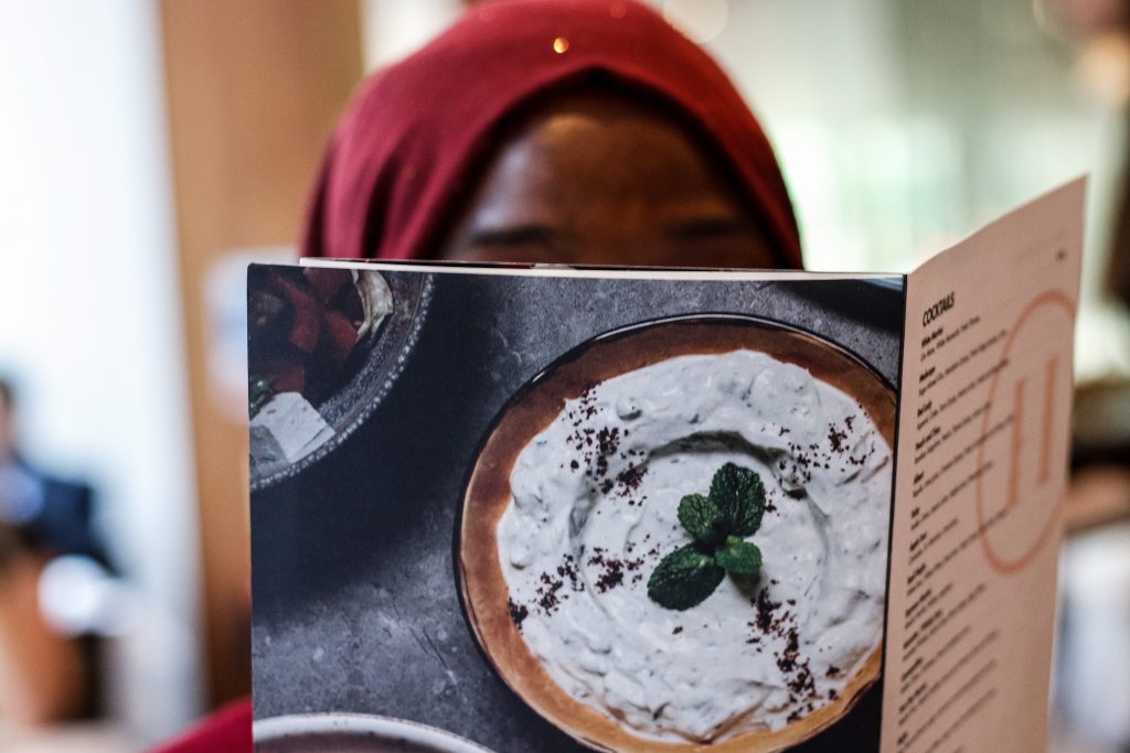 Woman looking at a restaurant menu